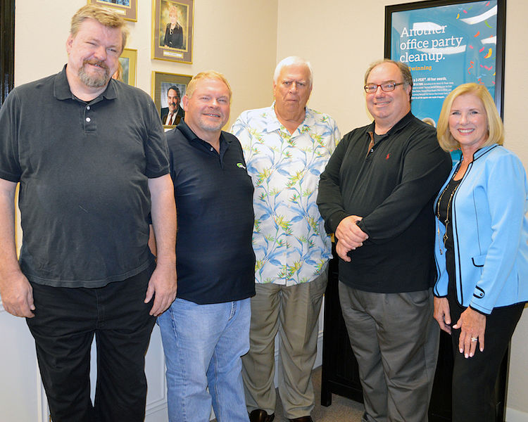 Hill Country Community Theatre Executive Director Mike Rademaekers (left) and HCCT Board President Linda DiFede (right) thanked the Martin Foundation, represented by Larson Lloyd, Charlie Keiser, Frank Reilly, and Robert Klaeger (not pictured), for the foundation’s generous donation of $10,000.  Martin Estate co-executor Frank Reilly (back right) looks on. (HCCT photo)