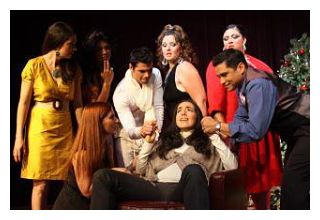 The cast, gathered around Natividad (Rina Rodriguez)(image: ALTA)